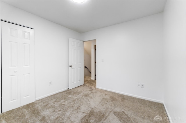 4513 Silver Oak St, Dayton, OH 45424 - unfurnished bedroom featuring carpet floors, baseboards, and a closet