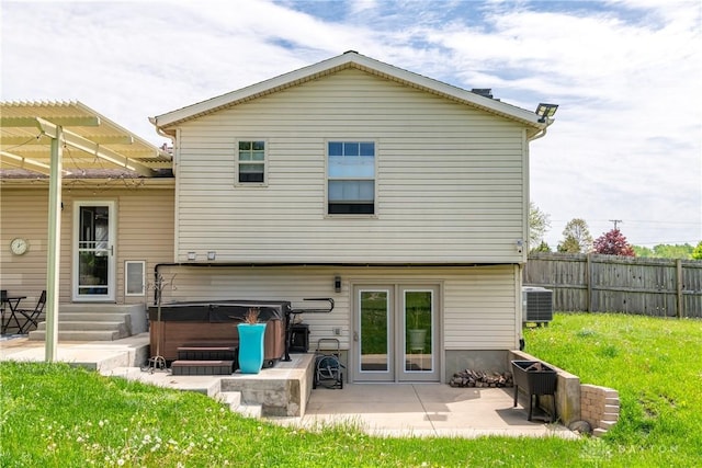 9673 Dayton Greenville Pike, Brookville, OH 45309 - rear view of property with a hot tub, central AC unit, and a patio