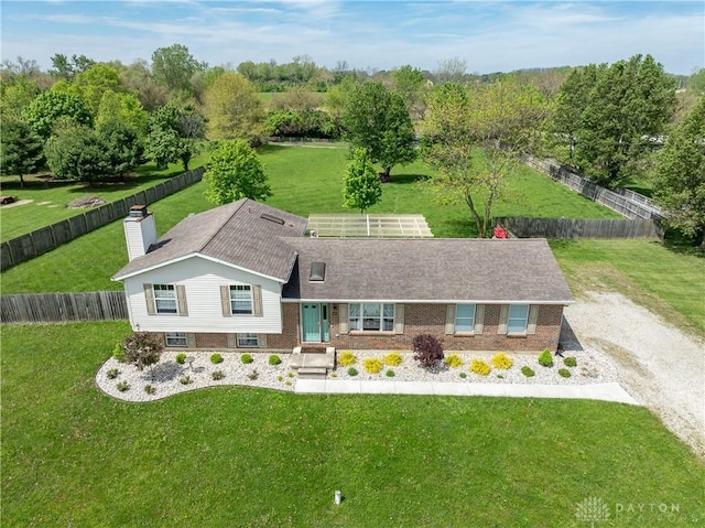 9673 Dayton Greenville Pike, Brookville, OH 45309 - view of front facade with brick siding and central AC