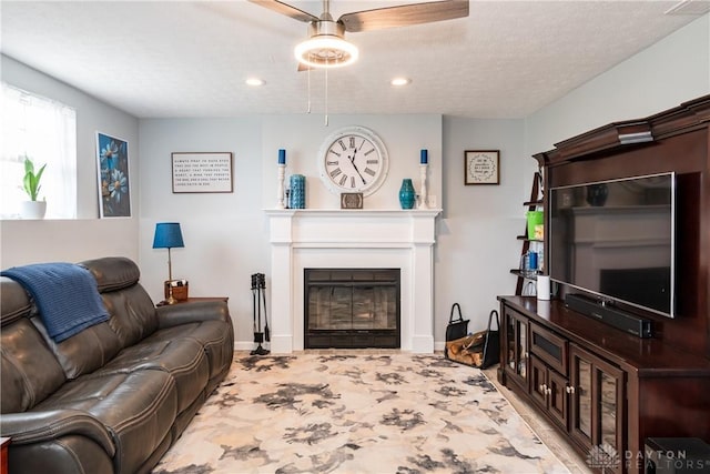 9673 Dayton Greenville Pike, Brookville, OH 45309 - living area with a glass covered fireplace, baseboards, recessed lighting, and ceiling fan