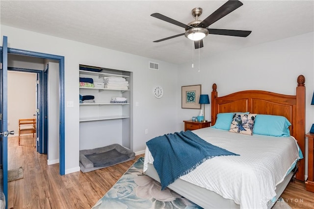 9673 Dayton Greenville Pike, Brookville, OH 45309 - bedroom featuring wood finished floors, baseboards, and ceiling fan
