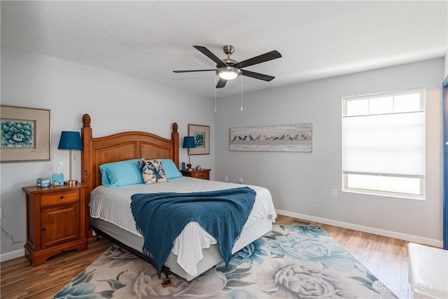 9673 Dayton Greenville Pike, Brookville, OH 45309 - bedroom with wood finished floors, baseboards, and ceiling fan
