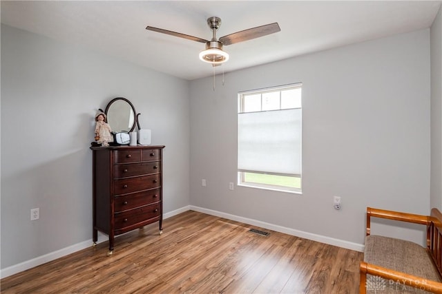 9673 Dayton Greenville Pike, Brookville, OH 45309 - sitting room featuring wood finished floors, a ceiling fan, and baseboards