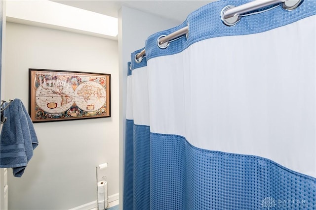 9673 Dayton Greenville Pike, Brookville, OH 45309 - bathroom featuring baseboards and a shower with curtain
