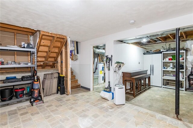 9673 Dayton Greenville Pike, Brookville, OH 45309 - finished below grade area with built in fridge, stairs, and electric water heater