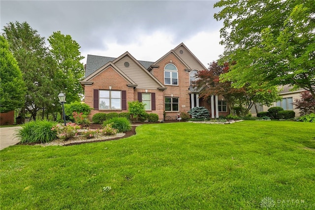 7299 Country Club Ln, West Chester, OH 45069 - traditional-style house featuring brick siding and a front yard