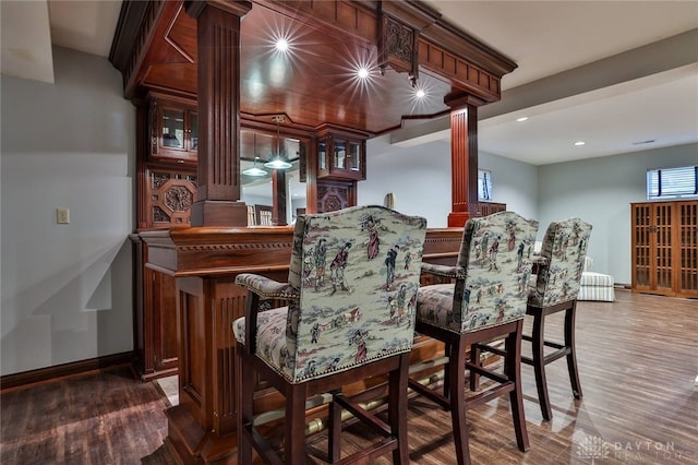 7299 Country Club Ln, West Chester, OH 45069 - bar area with decorative columns, wood finished floors, baseboards, and recessed lighting