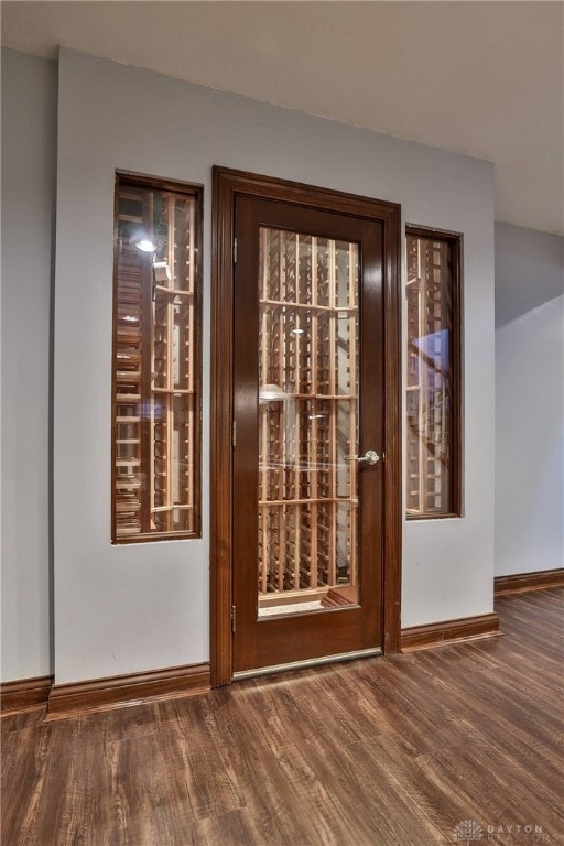 7299 Country Club Ln, West Chester, OH 45069 - doorway with baseboards and wood finished floors