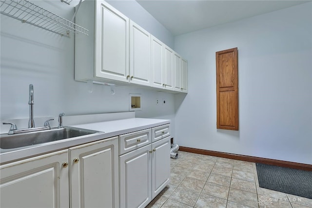 7299 Country Club Ln, West Chester, OH 45069 - laundry area with cabinet space, washer hookup, electric dryer hookup, baseboards, and light tile patterned floors