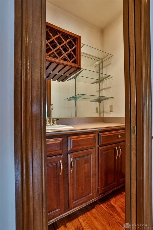 7299 Country Club Ln, West Chester, OH 45069 - indoor wet bar with dark wood-style flooring