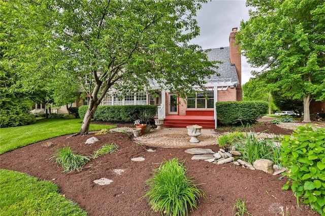 7299 Country Club Ln, West Chester, OH 45069 - view of property hidden behind natural elements with brick siding, a chimney, and a front lawn