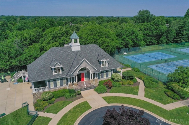 7299 Country Club Ln, West Chester, OH 45069 - view of front of house with a forest view, a chimney, and stone siding