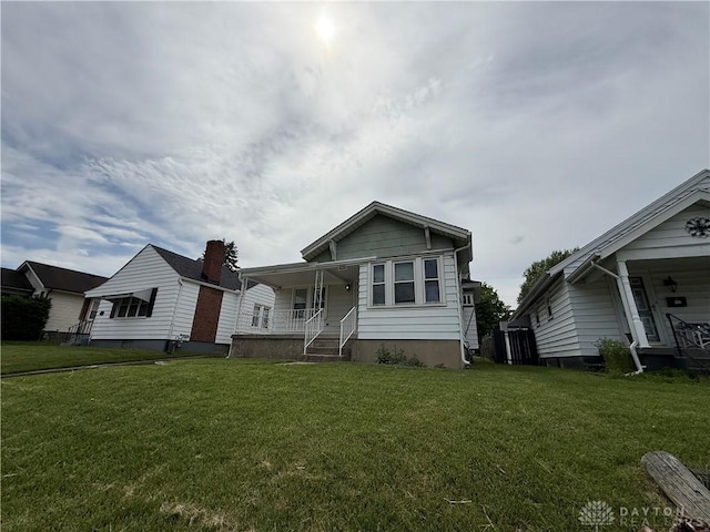 1805 Fauver Ave, Dayton, OH 45420 - view of front facade with covered porch and a front yard