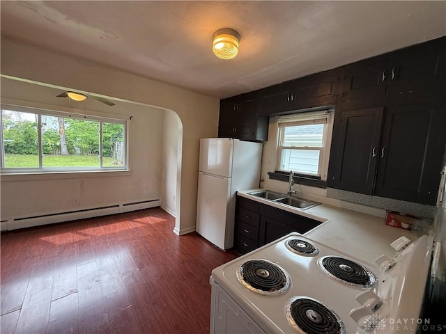 1805 Fauver Ave, Dayton, OH 45420 - kitchen with a baseboard radiator, a sink, white appliances, and dark cabinets