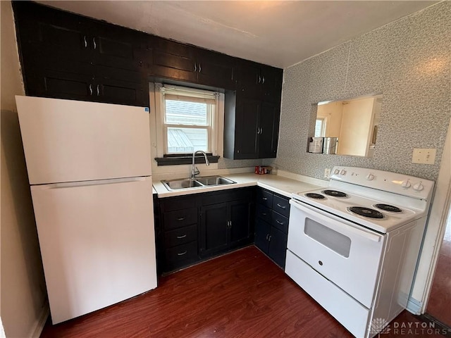 1805 Fauver Ave, Dayton, OH 45420 - kitchen featuring white appliances, a sink, dark cabinets, dark wood-style floors, and wallpapered walls