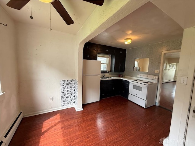 1805 Fauver Ave, Dayton, OH 45420 - kitchen with white appliances, a baseboard heating unit, ceiling fan, light countertops, and dark wood-type flooring