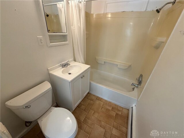 1805 Fauver Ave, Dayton, OH 45420 - full bathroom featuring vanity, shower / bath combo with shower curtain, toilet, and stone finish flooring
