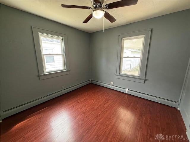 1805 Fauver Ave, Dayton, OH 45420 - spare room with wood finished floors, a baseboard heating unit, and ceiling fan