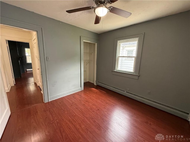 1805 Fauver Ave, Dayton, OH 45420 - unfurnished bedroom with a baseboard heating unit, wood finished floors, baseboards, and a closet