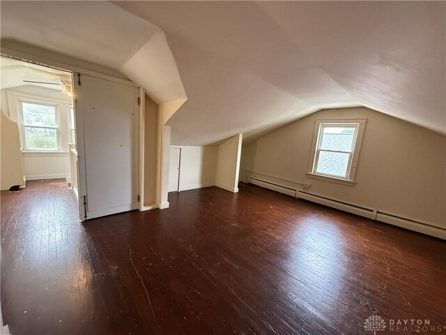 1805 Fauver Ave, Dayton, OH 45420 - additional living space with baseboard heating, vaulted ceiling, hardwood / wood-style floors, plenty of natural light, and baseboards