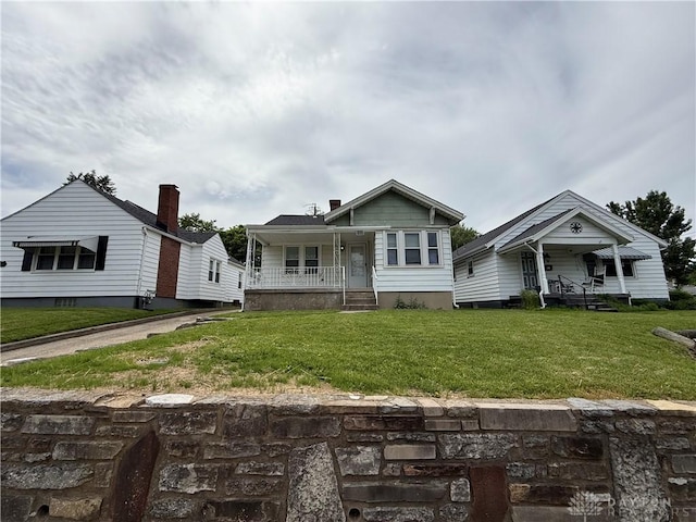 1805 Fauver Ave, Dayton, OH 45420 - view of front facade with covered porch and a front yard
