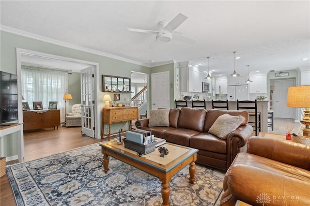2866 Fence Stone Ct, Dayton, OH 45458 - living room featuring a ceiling fan, wood finished floors, ornamental molding, stairs, and french doors