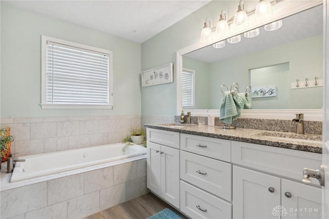 2866 Fence Stone Ct, Dayton, OH 45458 - full bathroom featuring double vanity, wood finished floors, healthy amount of natural light, and a garden tub