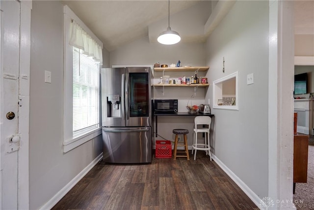 397 Chapman St, Waynesville, OH 45068 - kitchen with stainless steel fridge with ice dispenser, dark wood finished floors, black microwave, vaulted ceiling, and baseboards