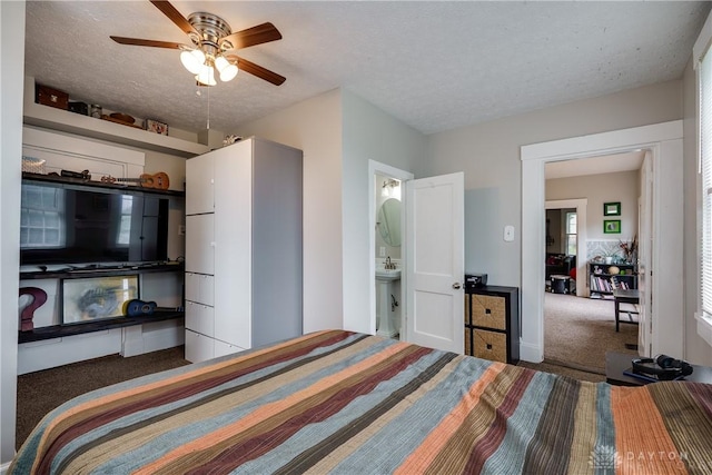 397 Chapman St, Waynesville, OH 45068 - carpeted bedroom featuring a textured ceiling, connected bathroom, and baseboards