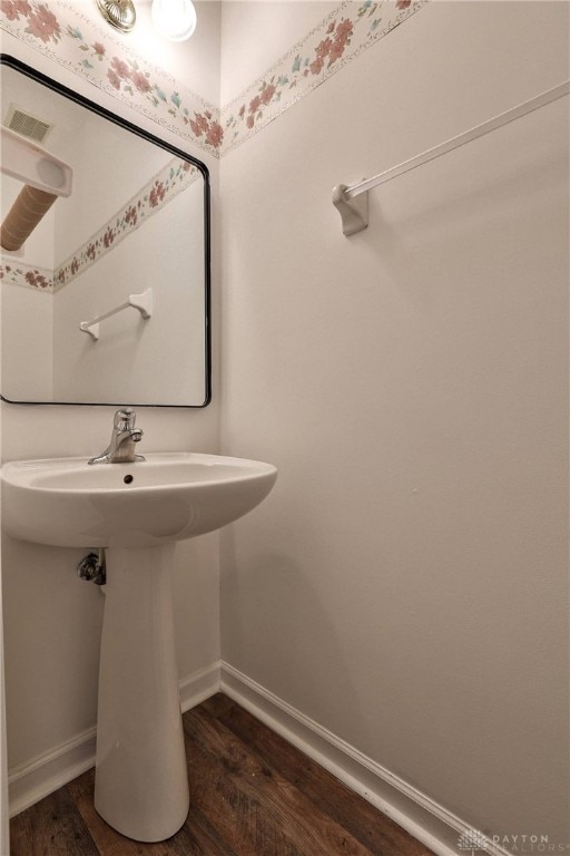 510 Delaware Xing, Trenton, OH 45067 - bathroom with a sink, baseboards, and wood finished floors
