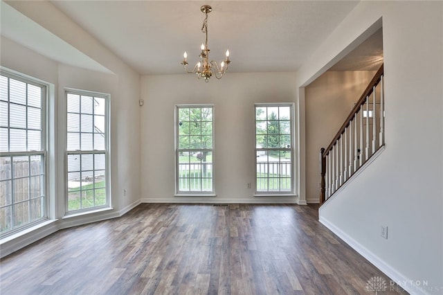 510 Delaware Xing, Trenton, OH 45067 - foyer featuring dark wood finished floors, a chandelier, stairs, and baseboards