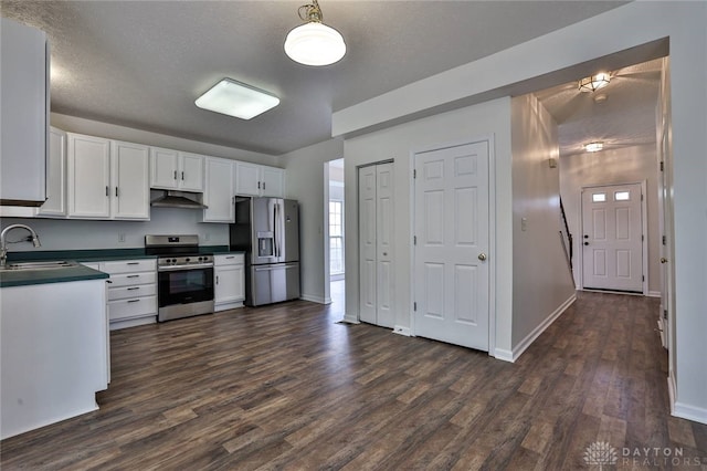 510 Delaware Xing, Trenton, OH 45067 - kitchen with stainless steel appliances, dark countertops, a sink, white cabinets, and dark wood-style floors