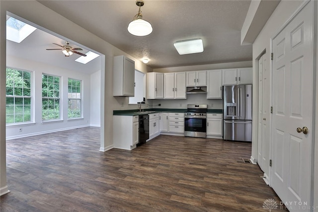 510 Delaware Xing, Trenton, OH 45067 - kitchen featuring appliances with stainless steel finishes, a skylight, dark countertops, and under cabinet range hood