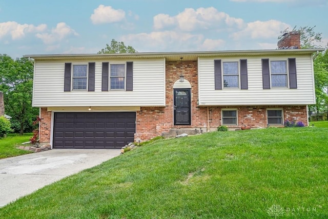 720 Boylston St, Middletown, OH 45044 - split foyer home with a garage, brick siding, and a front lawn