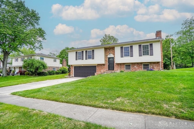 720 Boylston St, Middletown, OH 45044 - raised ranch with a chimney, an attached garage, brick siding, and a front lawn
