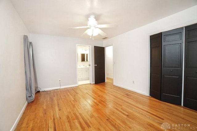 720 Boylston St, Middletown, OH 45044 - unfurnished bedroom with baseboards, light wood finished floors, ceiling fan, and connected bathroom