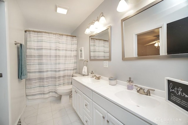 720 Boylston St, Middletown, OH 45044 - full bathroom with marble finish floors, double vanity, and toilet