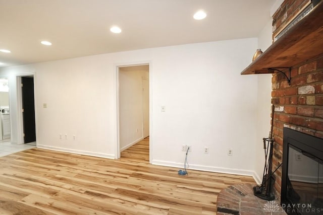 720 Boylston St, Middletown, OH 45044 - unfurnished living room featuring light wood-style flooring, a fireplace, recessed lighting, and baseboards