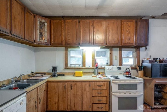 291 S W St, Xenia, OH 45385 - kitchen with white appliances, brown cabinets, and light countertops