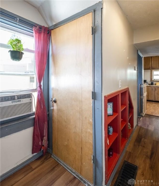 291 S W St, Xenia, OH 45385 - hall with wood finished floors, cooling unit, and lofted ceiling
