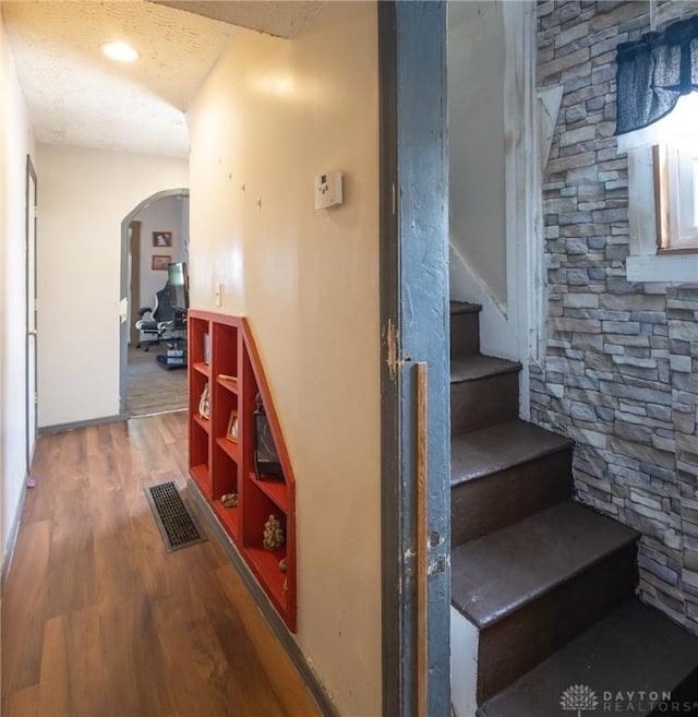 291 S W St, Xenia, OH 45385 - stairway featuring wood finished floors and arched walkways