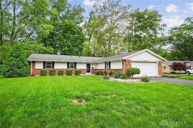 2765 Hemphill Rd, Kettering, OH 45440 - ranch-style house featuring brick siding, driveway, a garage, a front yard, and a chimney