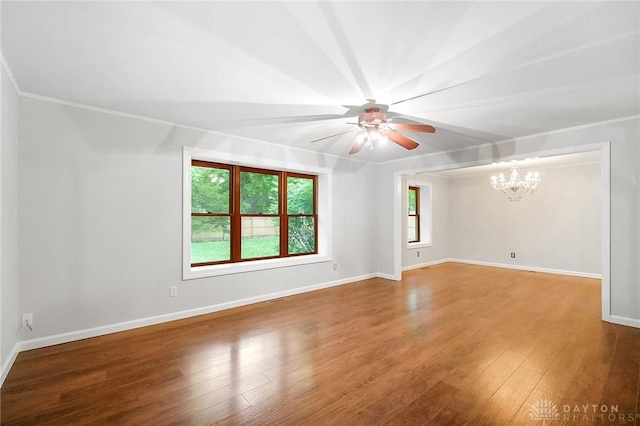 2765 Hemphill Rd, Kettering, OH 45440 - spare room with ceiling fan, a chandelier, wood finished floors, baseboards, and crown molding