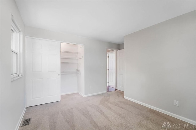 2765 Hemphill Rd, Kettering, OH 45440 - unfurnished bedroom with carpet, baseboards, and a closet