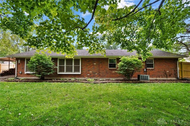 2765 Hemphill Rd, Kettering, OH 45440 - rear view of house with brick siding and central AC unit