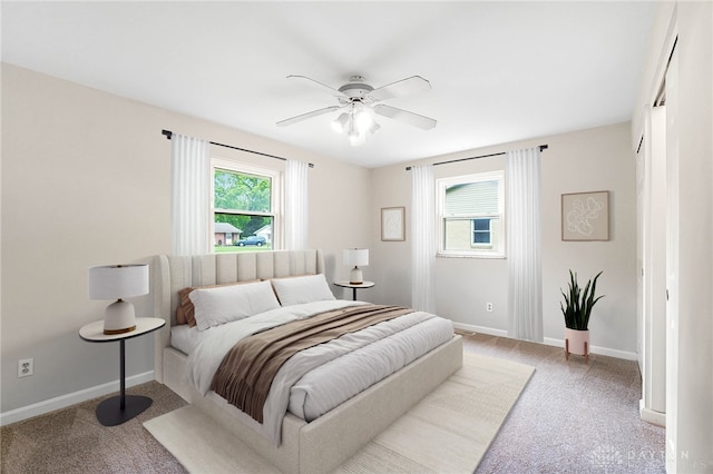 2765 Hemphill Rd, Kettering, OH 45440 - bedroom featuring light colored carpet, baseboards, and ceiling fan