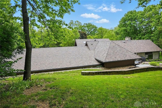 508 E Lower Springboro Rd, Clearcreek Twp, OH 45066 - back of house featuring a lawn and a chimney