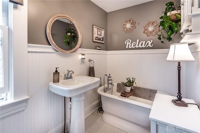 206 Wright Ave, Lebanon, OH 45036 - bathroom featuring wainscoting, a freestanding bath, and tile patterned flooring