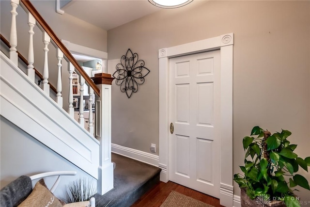 206 Wright Ave, Lebanon, OH 45036 - foyer entrance with dark wood-style flooring, stairs, and baseboards
