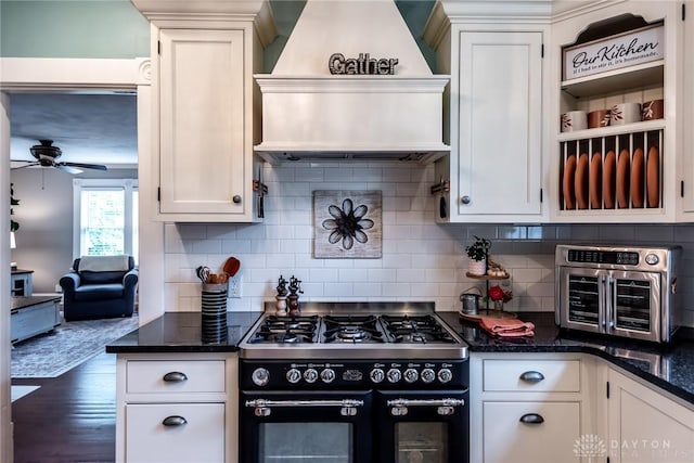 206 Wright Ave, Lebanon, OH 45036 - kitchen with range with two ovens, premium range hood, white cabinetry, ceiling fan, and wood finished floors